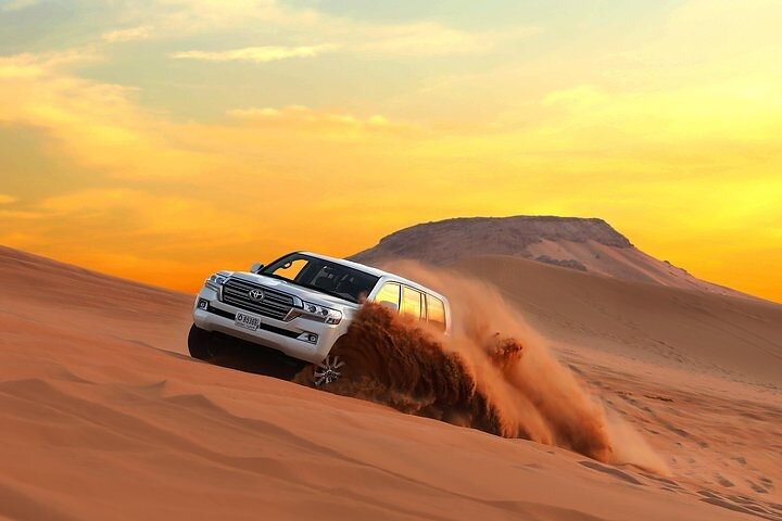 Experience the stunning contrasts of Dubai’s golden sands as you zip through the dunes creating unforgettable memories amidst breathtaking desert vistas and luxurious comforts.